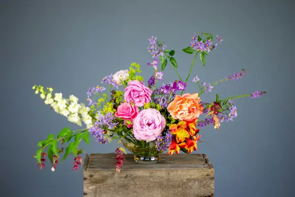 Loose garden-style arrangement on a wooden box