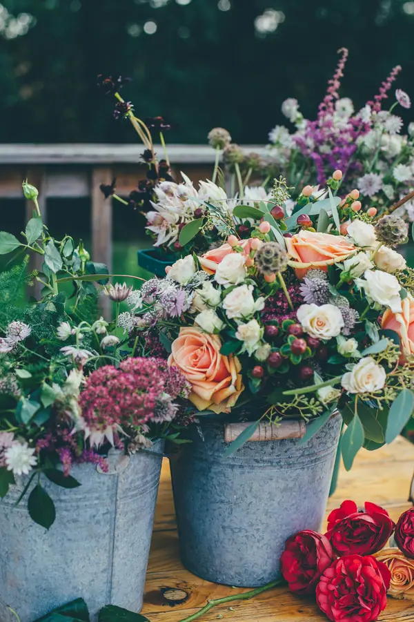 Buckets of mixed garden flowers at a flower market