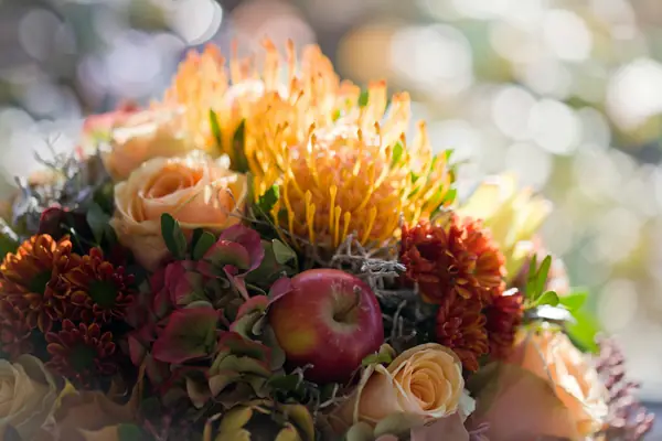 Autumn flowers with roses and apples