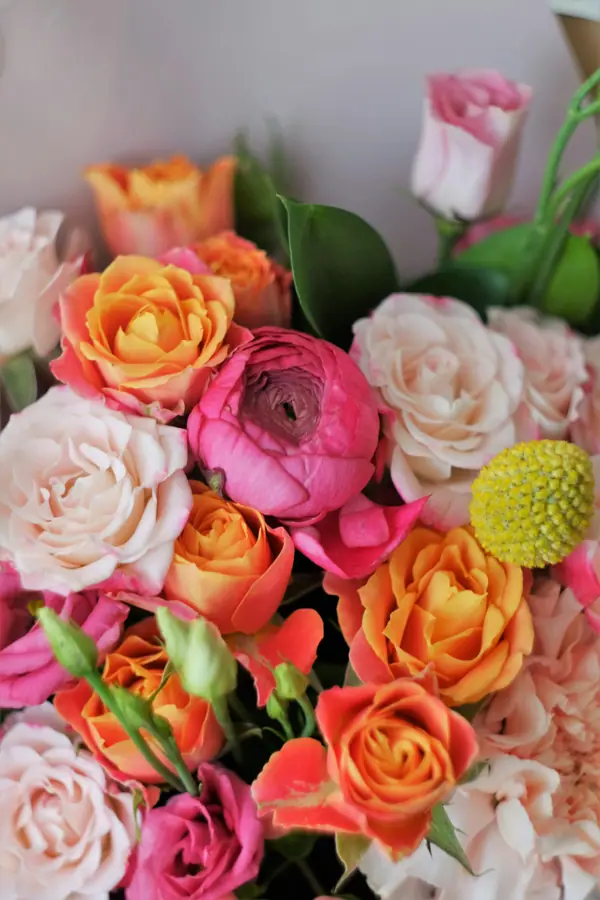 Bright bouquet of pink, peach and orange roses